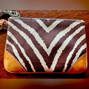 Coach Wristlet with Leather trim. Small stains leather.